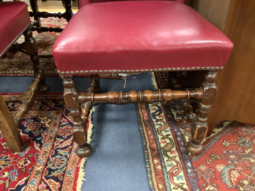 A set of six early 20th century Jacobean style oak high back dining chairs